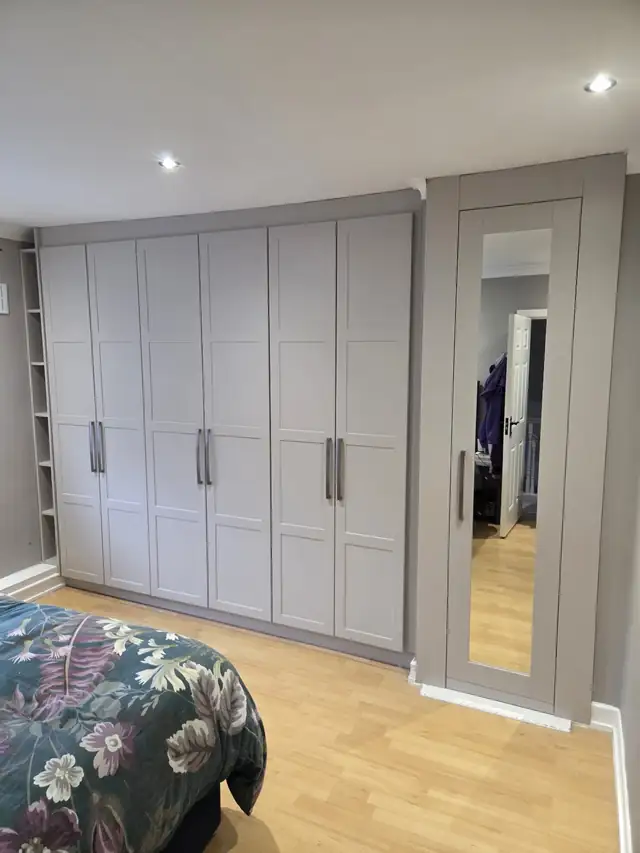 Grey shaker fitted wardrobes with a full length mirror door