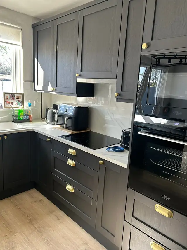 Charcoal shaker kitchen with brass handles